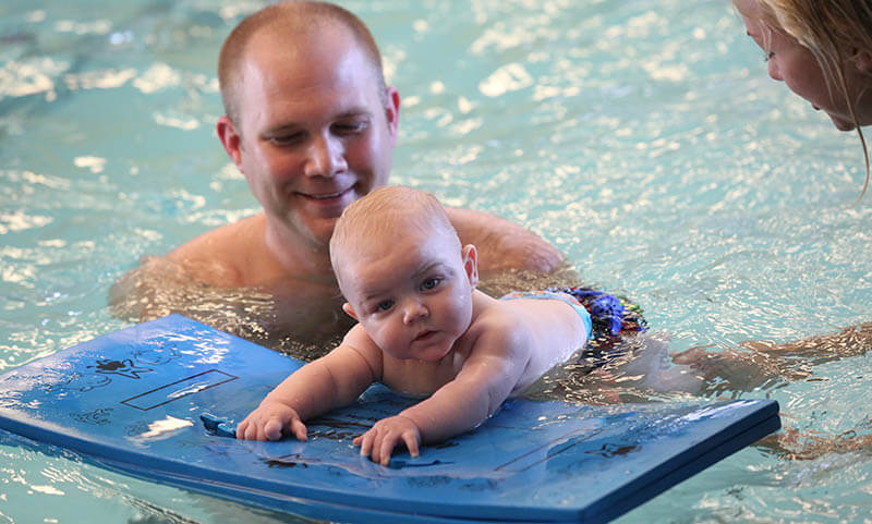 dad-swimming-with-baby